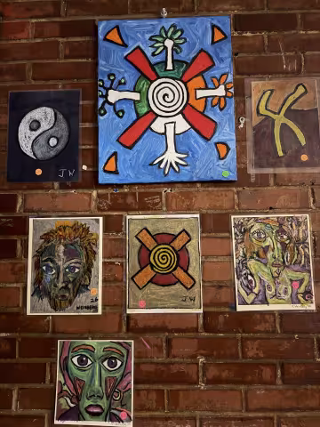 Bold and colorful artwork hanging up at flask by jason weinberg.
